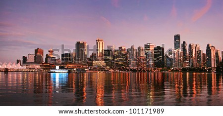 Beautiful view of Vancouver skyline at sunset as seen from Stanley Park, BC, Canada