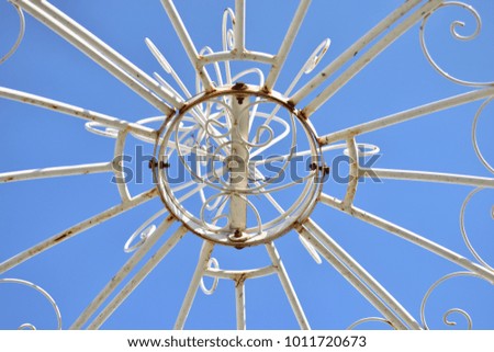 Closeup beautiful white metal frames with blue sky as background , bottom view