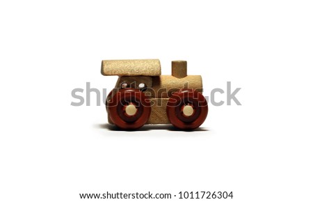 Toy wooden train with a white background. Children's toy. Little train.