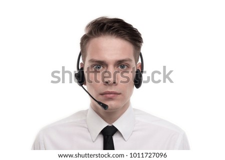 Close-up photo of young calm agent of call centre