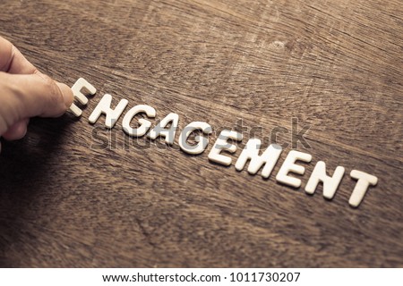 Hand arrange wood letters as Engagement word for marketing concept Royalty-Free Stock Photo #1011730207