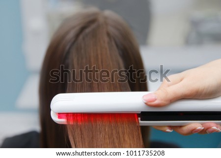 keratin recovery hair and protein treatment pile with professional ultrasonic iron tool. Concept lamination, lifting