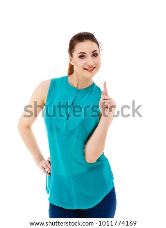 Woman showing something up above her with her finger isolated on white background 