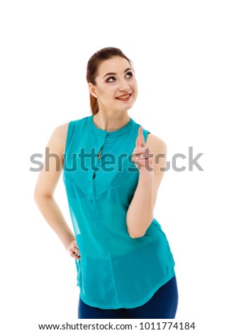 Woman showing something up above her with her finger isolated on white background 