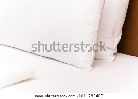 Decorated Bed - White bedsheet cusion in Hotel Room 