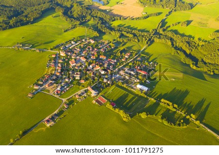 Aerial view of a small town in countryside. Scenic seasonal landscape from above. Slavce in South Bohemia, Czech republic, European union.