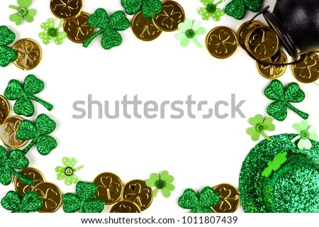 St Patricks Day frame isolated on a white background. Above view with Pot of Gold, shamrocks and leprechaun hat.