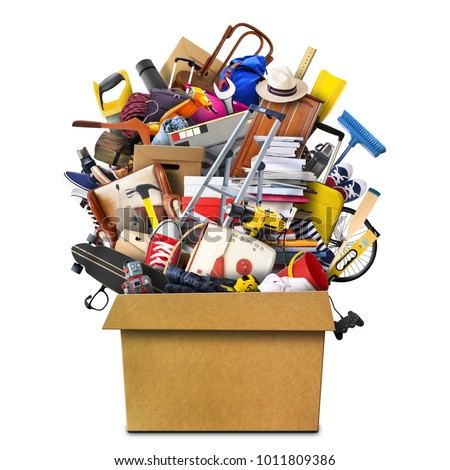 Large pile of household things in a box Royalty-Free Stock Photo #1011809386
