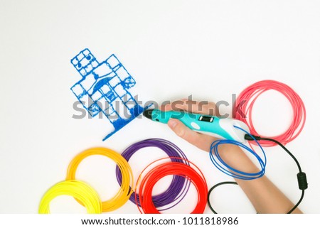 Mock up. 3d handle (pen). Colored plastic in coils. 3d paintings and figures with their own hands. Handmade. STEM education. Play and study at school and at home. New toy for child. Background. Royalty-Free Stock Photo #1011818986