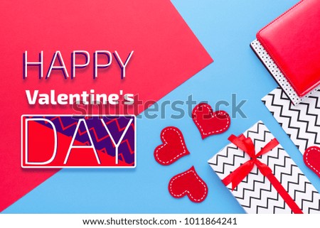 Person holding a present for Saint Valentine's day in his hands. Beautiful colorful background to st. Valentine day. Greeting card with red hearts. Wedding's invitation. Love expression. 