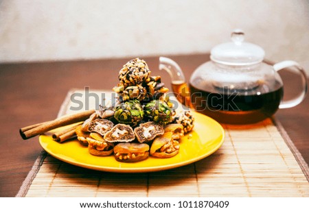 Turkish sweets with coffee and tea on a wooden table
