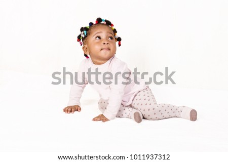 Portrait of a nice baby looking up isolated on a white background.