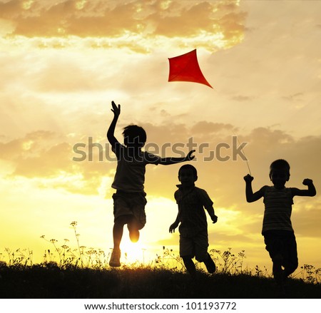Children running with kite Royalty-Free Stock Photo #101193772