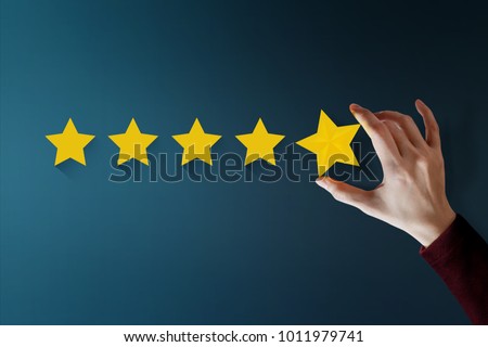 Customer Experience Concept, Best Excellent Services for Satisfaction present by Hand of Client giving a Five Star Rating Royalty-Free Stock Photo #1011979741
