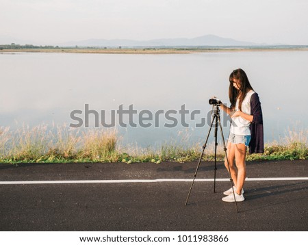 young asian woman photography with tripod