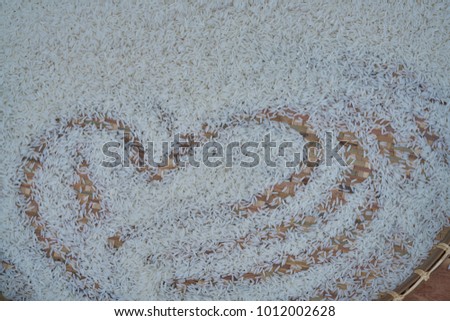 Picture of  heart on jasmine rice for background.