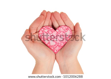 female hands holding pink heart on white background top view. Love, marriage, engagement, Valentine's day concept