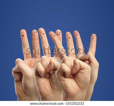 Happy group of finger smileys with social chat sign and speech bubbles,icons. Fingers representing a social network.