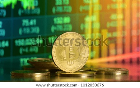 Bitcoin with chart background. New virtual cryptocurrency concept.
