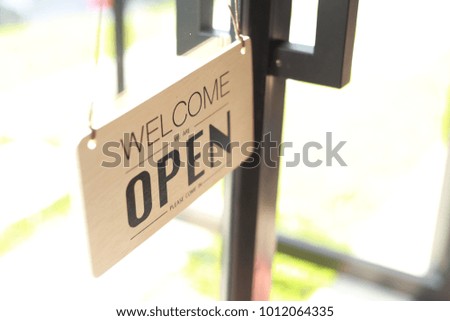 Open signs hanging with chain,