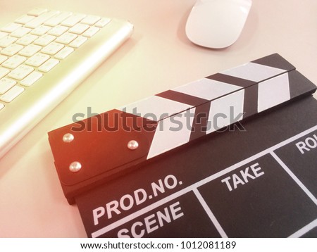 Black Slate movie with keyboard and mouse on white background with light flair.