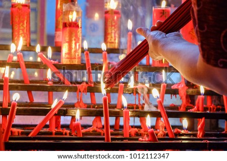 
Burning candles during Chinese New Year celebration. Royalty-Free Stock Photo #1012112347