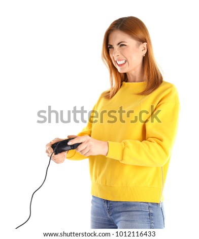 Emotional woman with video game controller on white background