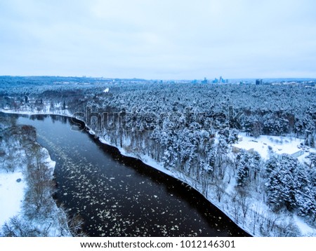 Vilnius, Lithuania: aerial top view of Neris river and Vingis park in beautiful colors of winter
