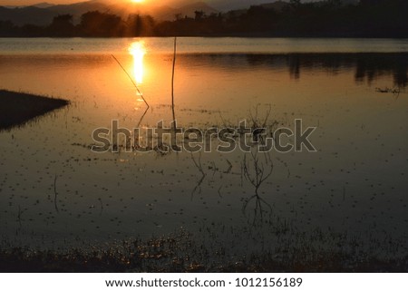 The reservoir at the mountain the sun light orange