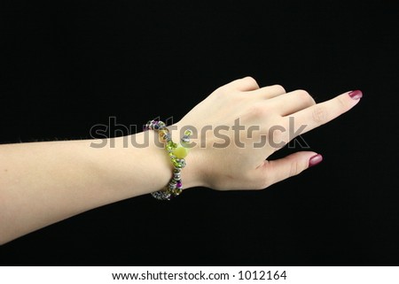 Young ladies arm wearing bracelet.