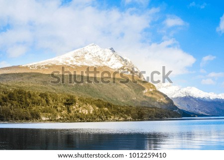 Landscapes of argentina with a view to mountains covered with snow and lake