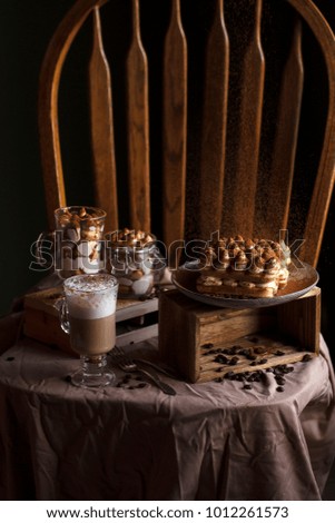 Tiramisu in a glass cup on the chair