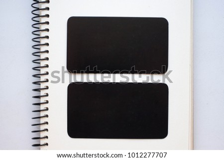 black blank business cards with rounded corners on a craft background