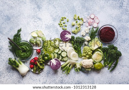 Plant based raw food vegan food cooking background. Flat-lay of fresh vegetables, greens, smoothie bowl superfoods o top view, copy space. Clean eating, alkaline diet, vegetarian concept Royalty-Free Stock Photo #1012313128