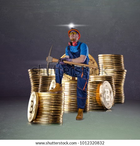 Miner man posing with a golden bitcoin stacks of coins on a background. Bitcoin mining virtual cryptocurrency concept