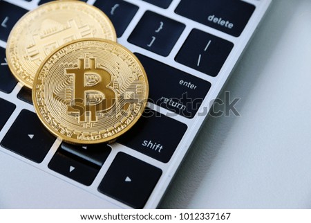 Gold Bitcoin on keyboard Laptop,digital Electronic money of the year 2018 
