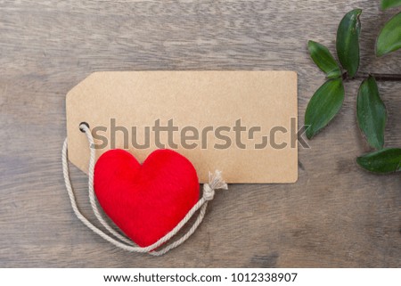 Love Concept : red heart  on paper brown wooden table background. space for text. valentine days, dating, making love concept