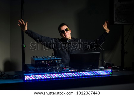 DJ leading the party - music from a computer