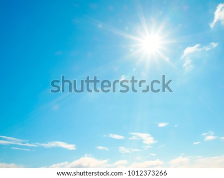 The beautiful sky with clouds and sun, real photo