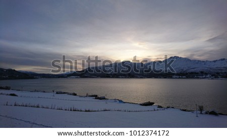 Marvelous Kvaløya a beautiful fjord island close to Tromsø, Troms County, Norway, in the marvellous dying light of a short arctic Winter Day