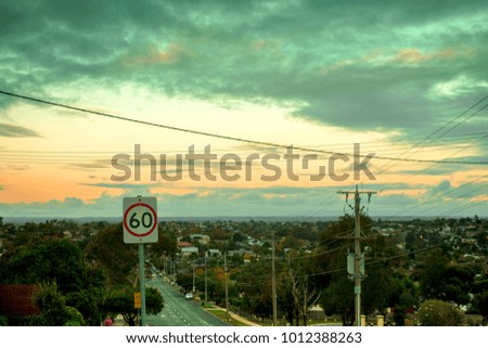 Suburbs and Speed marker under Clouds in the Evening