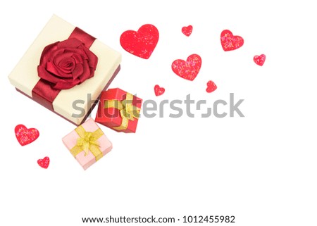 Gift box with red bow ribbon and lovely hearts isolated on white background for Valentines day