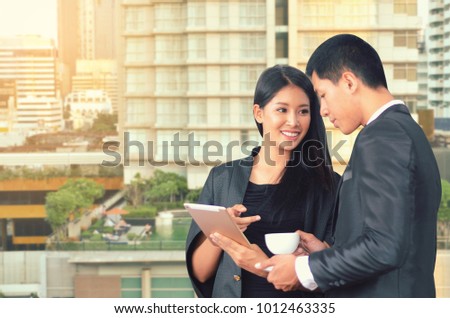 Business man and business woman are working in office