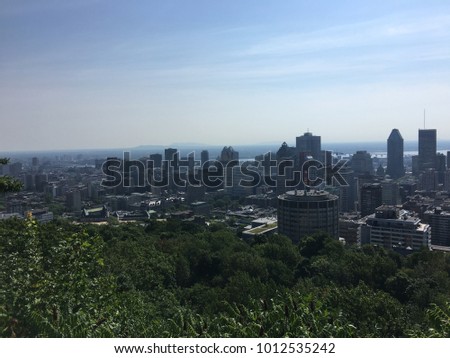 Downtown Montreal skyline on a clear summer day from the top of Mount Royal.