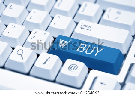 Shopping cart icon button on the key of a computer keyboard