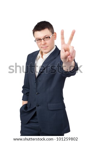 Portrait of young business man showing victory sign isolated on white background