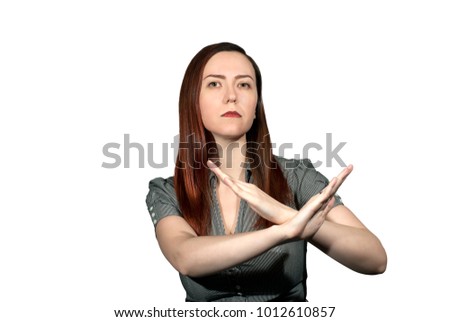 woman on a white background crossed her arms in a forbidding gesture Royalty-Free Stock Photo #1012610857