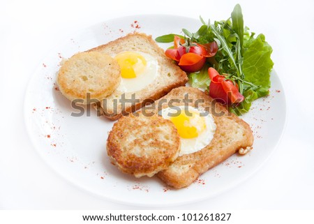 delicious fried eggs with toast, tomato, pancakes for breakfast