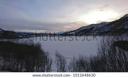 Frigid winter fjord landscape on Hinnøya, Troms County, Norway