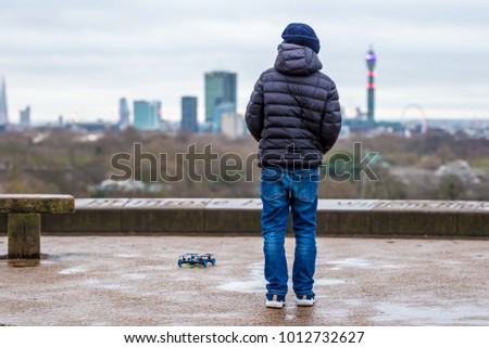 Buy operating his drone in the morning at Primrose hill, London, UK